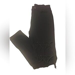 Product: Black jeans with design on both thighs.